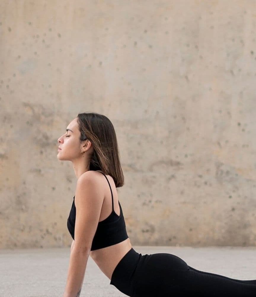 Woman stretching her neck with eyes closed