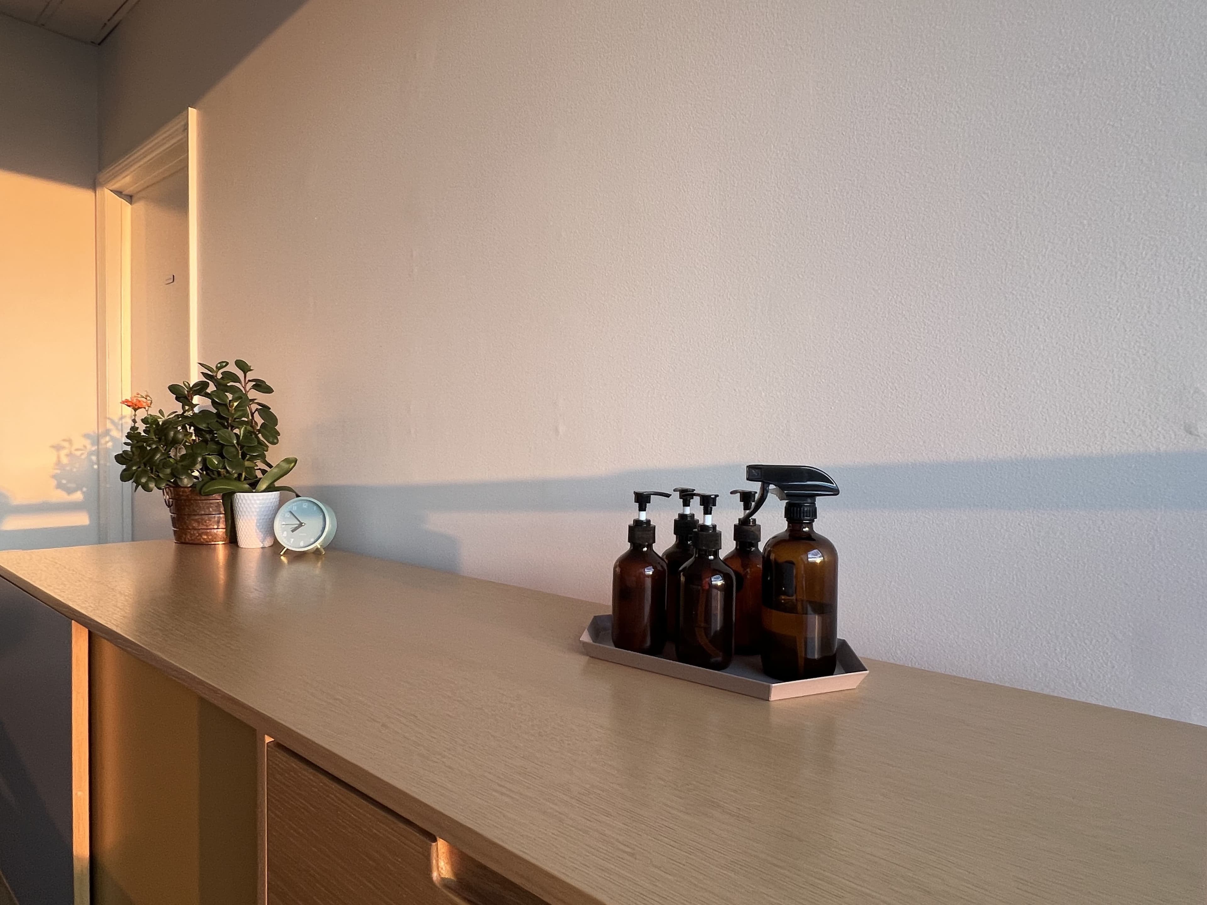 Counter with amber bottles in warm evening light