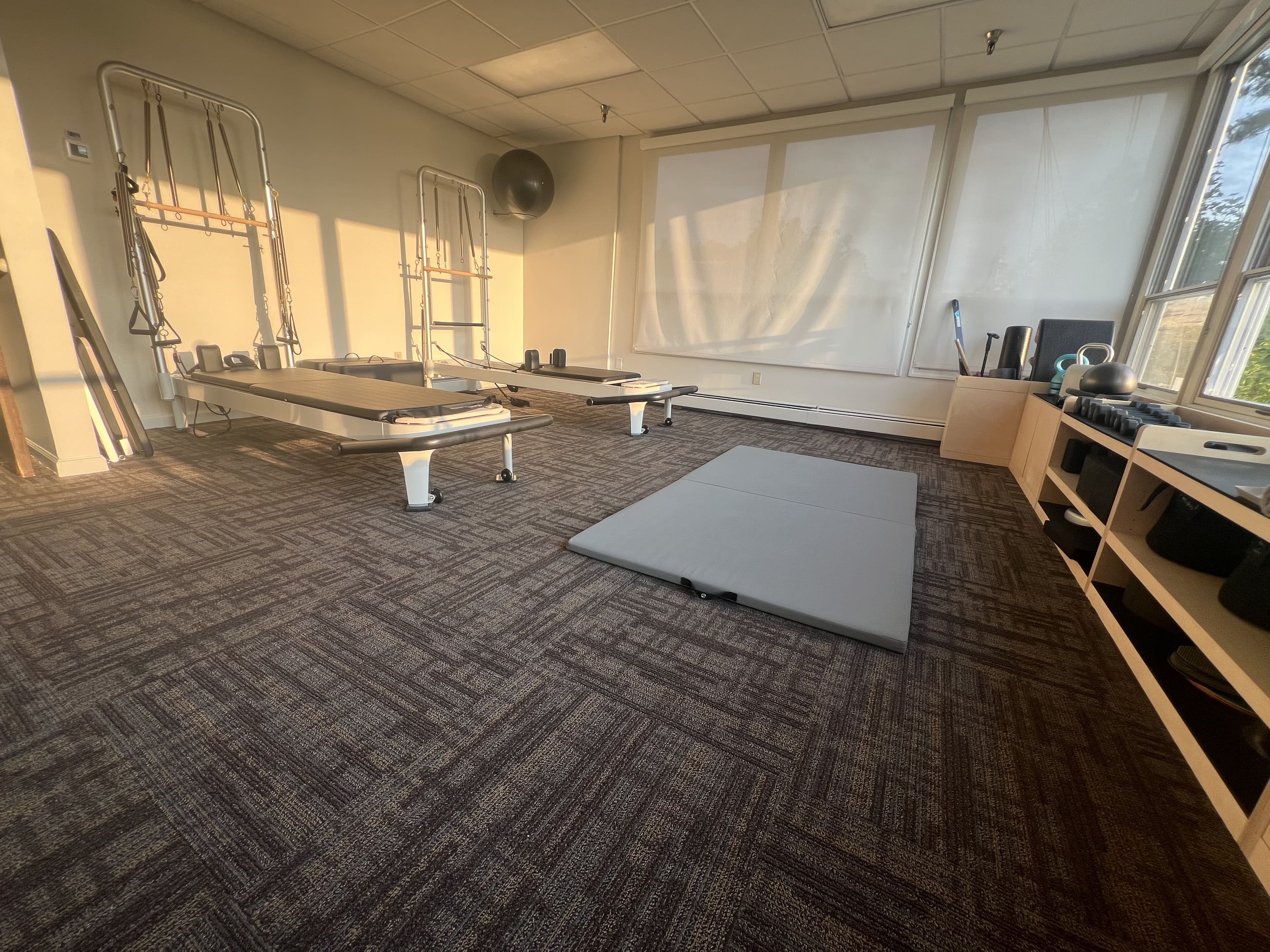 Pilates studio with reformers and mats