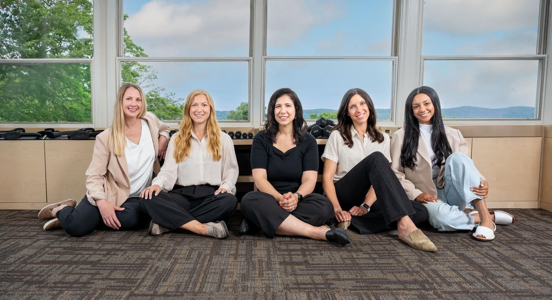 The Good Life Physical Therapy team seated together in the clinic